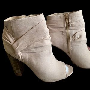 Natural color peep toe booties with 4” heel.